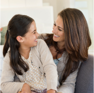 A mother enjoying time with her daughter knowing her investments strategies are sound.