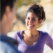 A woman smiling knowing she is protected with universal life insurance.