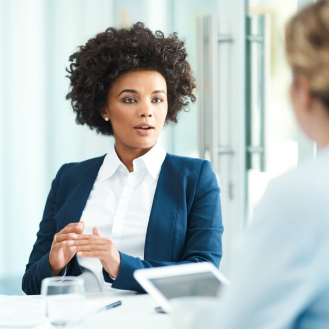 A financial professional discussing with a law firm representative how to use Protective Executive 10-Year Term to create more coverage for partners.