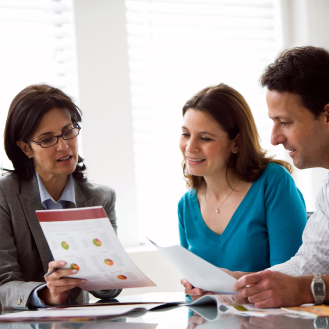 A financial professional working with clients.