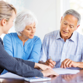 A financial advisor meets with clients to understand their retirement income and lifestyle goals.