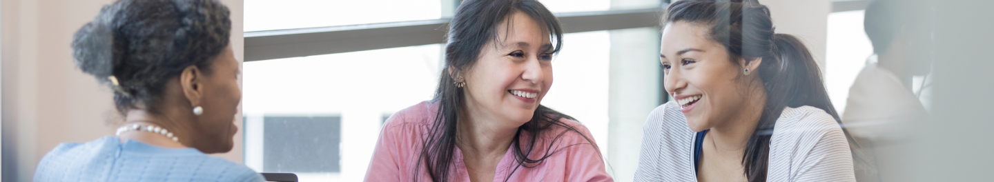 A financial professional meeting with a mother and daughter