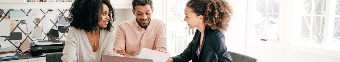 Three people discussing life insurance options. 