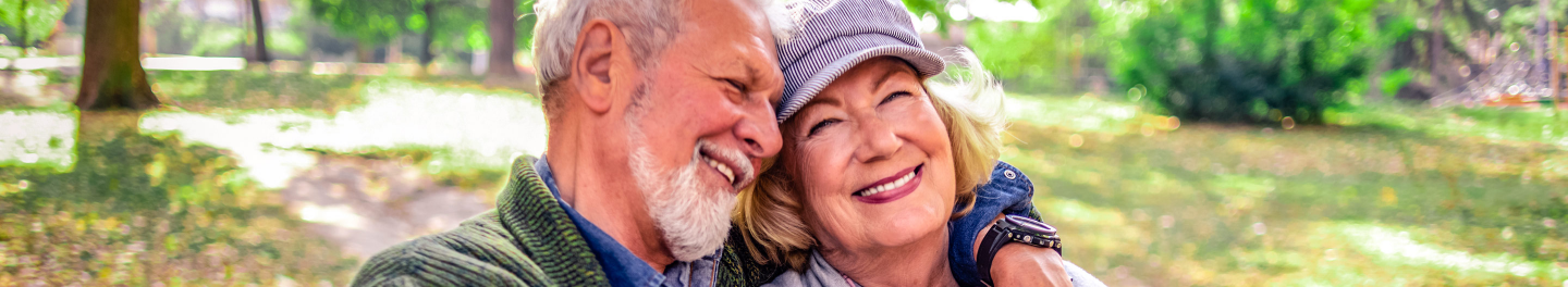 Happy couple enjoying a secure retirement with a solid guaranteed income plan. 