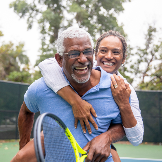 Couple enjoying time together on a tennis court