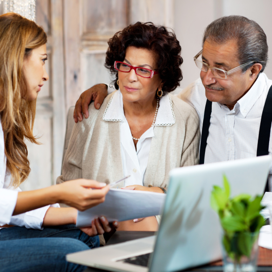 A couple who represent the ideal clients for a registered indexed-linked annuity speaks to a financial professional.