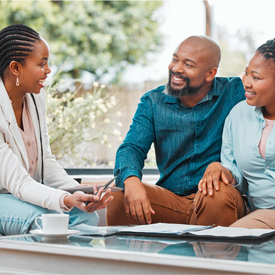 A financial professional discussing Protective ProClassic Legacy UL with two clients.