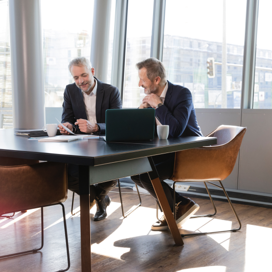 A financial professional talking about Protective Executive 10-Year Term with a business client.