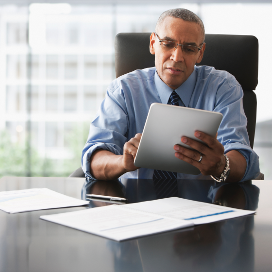 A financial professional reviewing details about 10-Year Term on a tablet