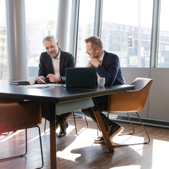 A financial professional meets with a business client about Protective Executive UL