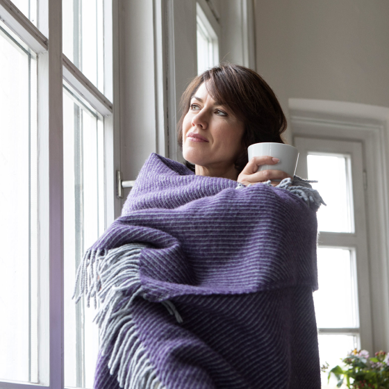 a woman looking relaxed knowing the ExtendCare Rider provides protection if she has chronic illness needs in the future