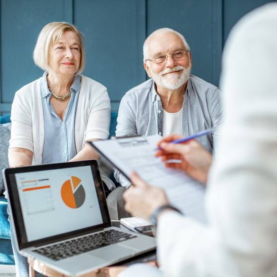A retired couple discussing Protective Investors Benefit Advisory VUL with their financial professional