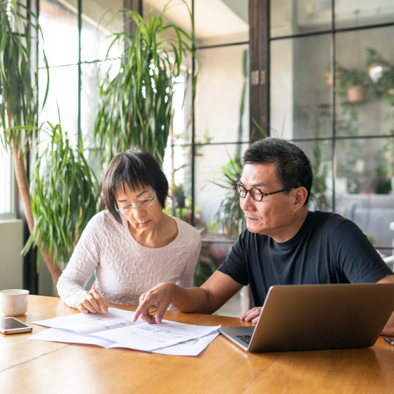 An older couple reviewing product specs for Protective Investors Benefit Advisory VUL variable universal life insurance.