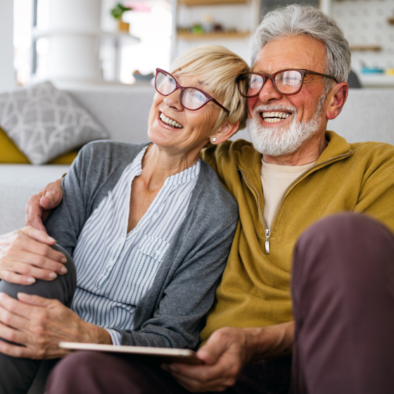 A smiling retired couple.