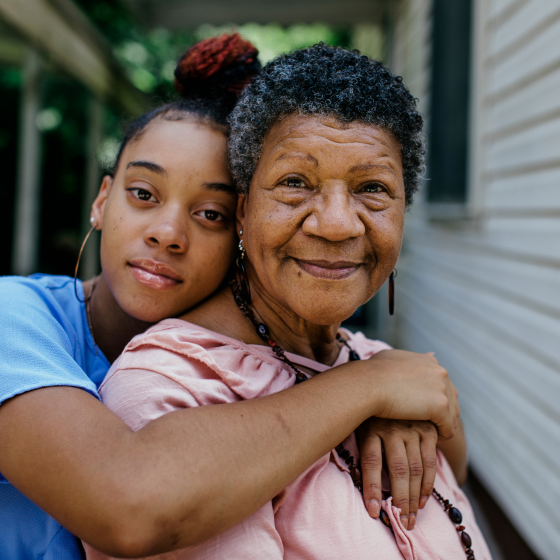A grandmother looking content knowing her granddaughter's future is protected by the Protective Series Foundation annuity.
