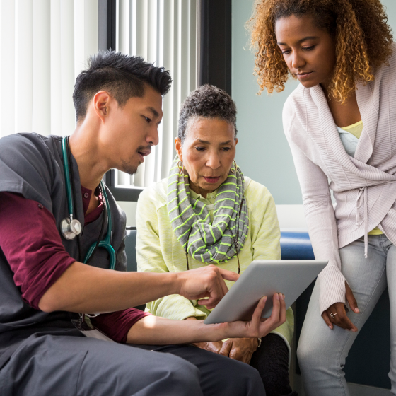A doctor discussing a treatment option with a woman and her daughter that could be covered that could be covered with the optional benefits on Protective Series Estate Maximizer