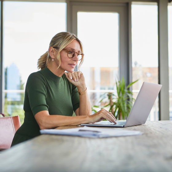 Potential Protective Aspirations policy holder reviewing product specs on laptop