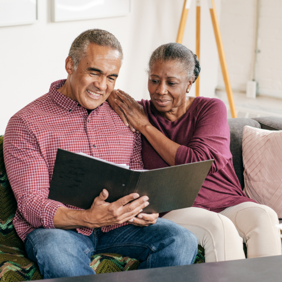 a husband and wife reviewing information about the Protective SecurePay Pro optional lifetime income benefit.
