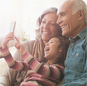 Grandparents smile with their grandson as they think about the financial legacy they've  created with Protective Series Estate Maximizer℠.