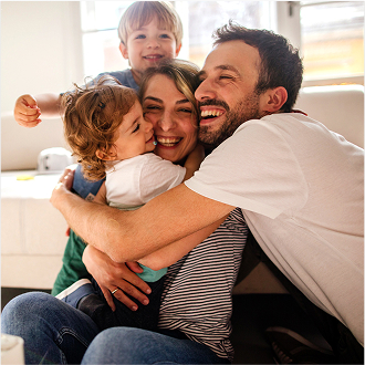 A young family embracing, knowing they are protected with Protective ProClassic II UL.