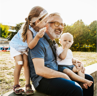 Retiree enjoying time with his grandchildren knowing his Protective annuity provides lifetime coverage and income protection.