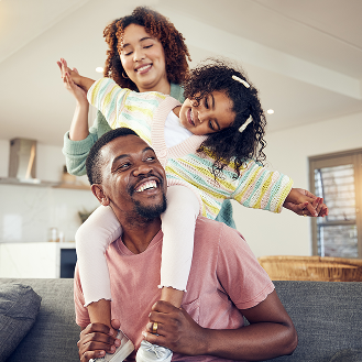 A young family having fun together, knowing they are protected with Protective Non-Participating Whole Life.