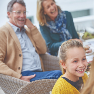 A couple enjoying time with their grandchildren, knowing they are protected with Protective Advantage Choice universal life insurance.