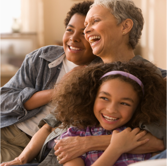 A woman spending time with her grandchildren and happy knowing her income is protected with Protective Income Creator Fixed Annuity.