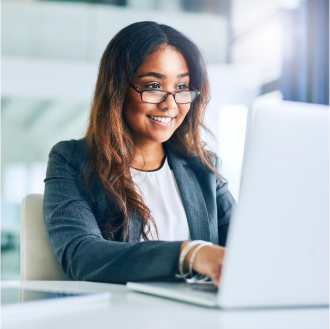 A financial professional using a laptop to check on the status of her client's claim with Protective.