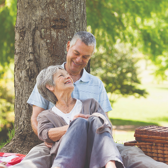 A couple smiling together, knowing they are protected with optional life insurance benefits from Protective.
