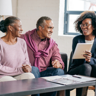 A financial professional sharing information about universal life insurance with her clients.